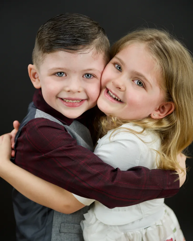 Sibling acting portrait photographed outdoors