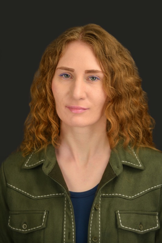 A friendly professional headshot with a clean background