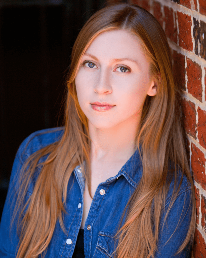 Professional actor headshot in NYC with a confident expression and natural lighting.