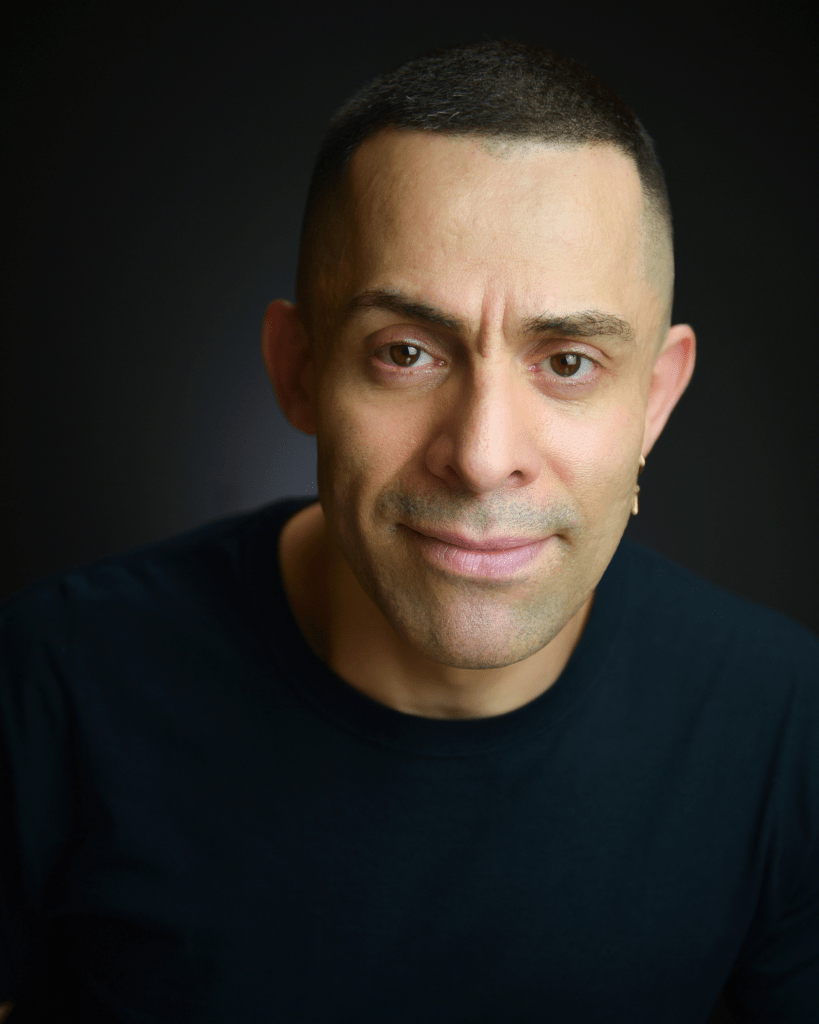 Professional actor headshot taken in a studio with expert lighting.